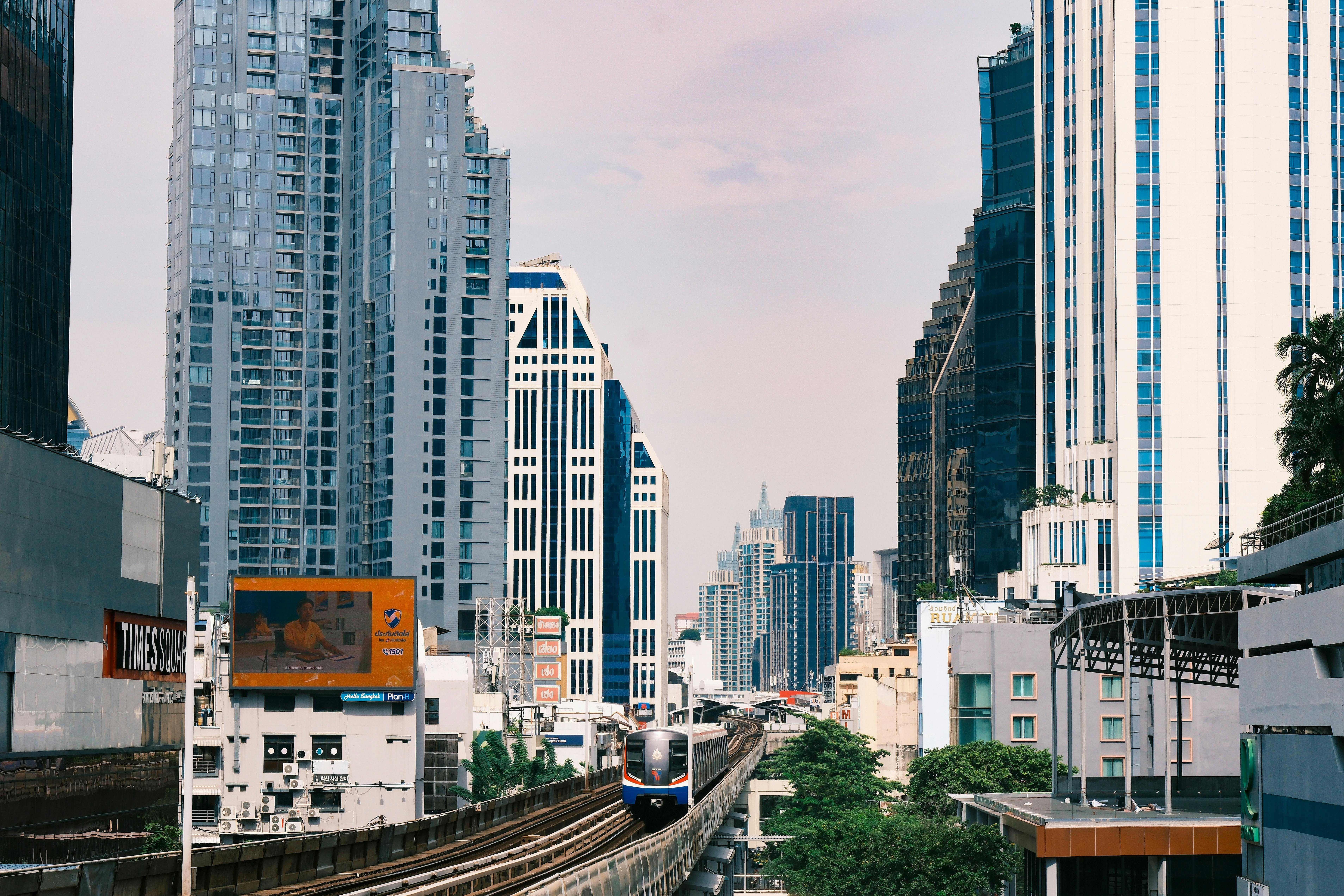 Skytrain Moving Through Bangkok Skyscrapers